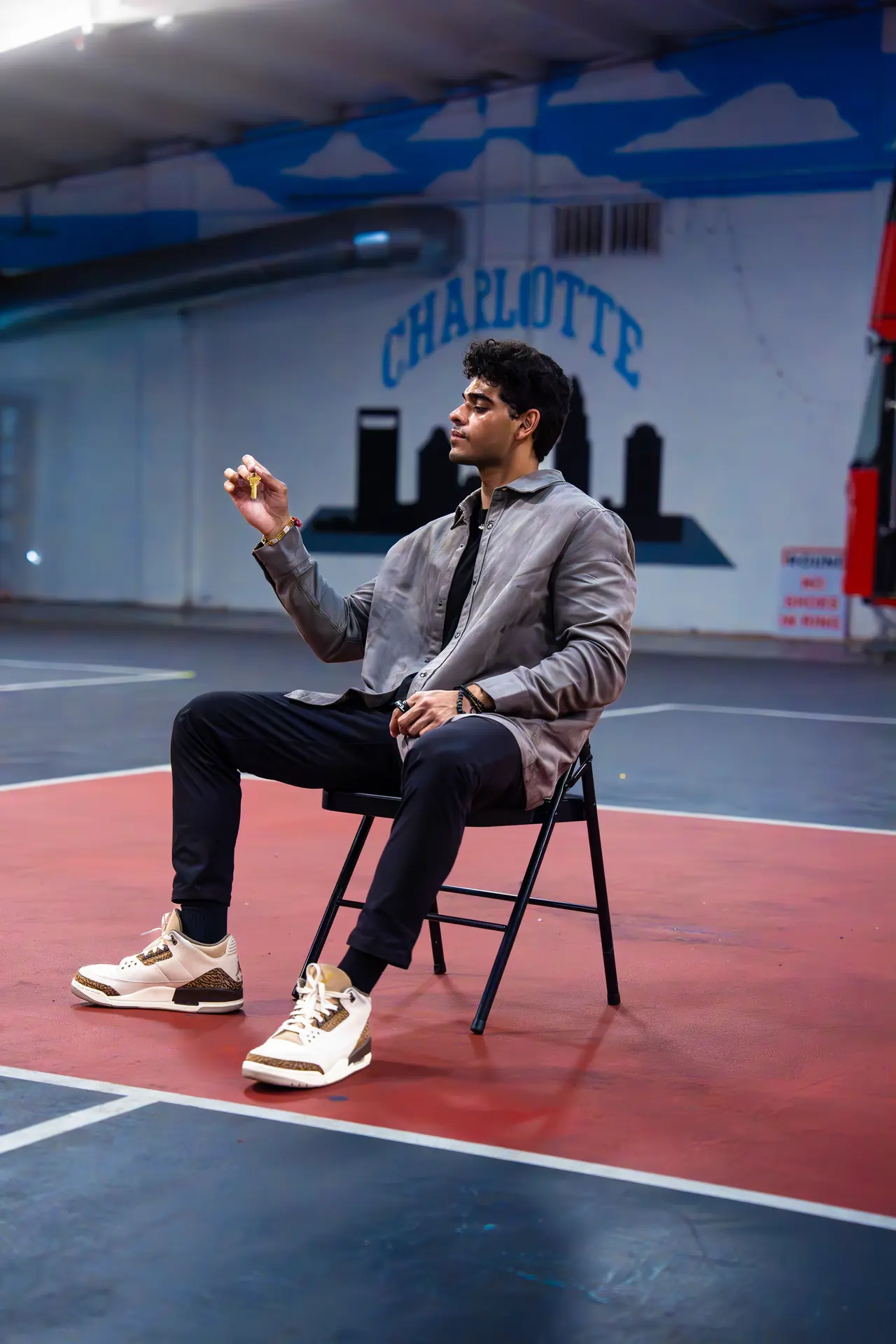 Anu Gym owner holding keys to new gym location